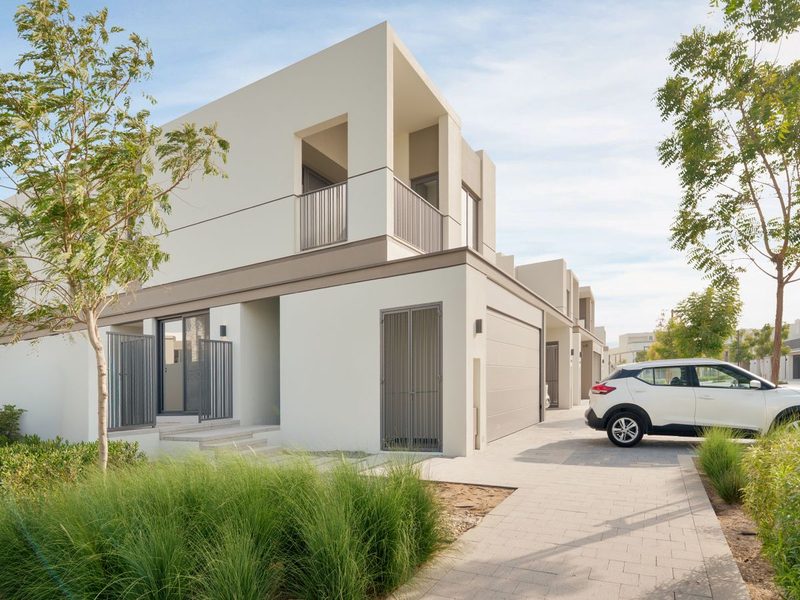 Modern villa with a driveway and garden